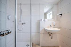 Koupelna v ubytování Boutique Hotel Erb München Parsdorf