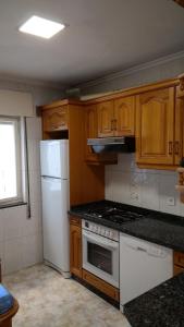 Dapur atau dapur kecil di Apartamento La Paz - Habitaciones con baño no compartido en pasillo
