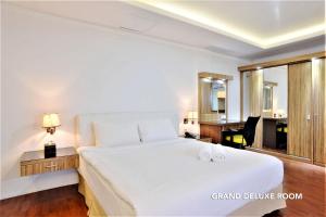 Postel nebo postele na pokoji v ubytování Kasira Residence + 37 fotografií