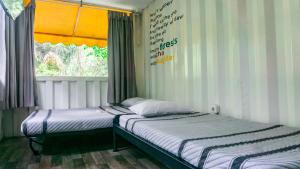 Letto o letti in una camera di Hau Eco Lodges Citumang Pangandaran