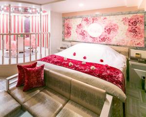 Rúm í herbergi á Hotel Regent (Adult Only)