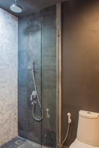 a shower in a bathroom with a toilet at OneBedroom with Balcony at Saturdays Residence in Rawai Beach