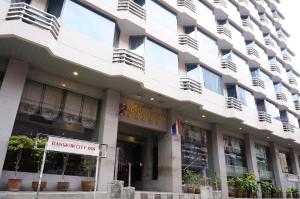 a building with a sign that reads embassy city inn at Bangkok City Inn in Bangkok