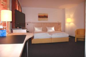 Postel nebo postele na pokoji v ubytování Hotel Barth