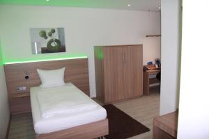 Postel nebo postele na pokoji v ubytování Hotel Barth