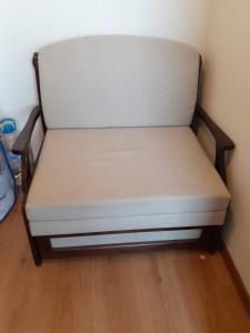 a bed sitting in the corner of a room at Sanny view South- Студия Мир авангарда in Sunny Beach
