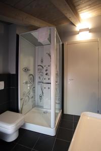 a bathroom with a shower and a toilet at Albergo al Vecchio Tram in Udine