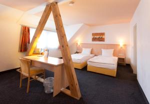 Postel nebo postele na pokoji v ubytování Hotel Barth