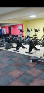 a gym with a bunch of exercise bikes in a room at Tahir Guest Palace in Kano