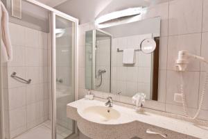 Koupelna v ubytování Astor & Aparthotel
