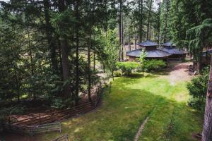 an aerial view of a house in the woods at Misty Meadows B&B in Langford