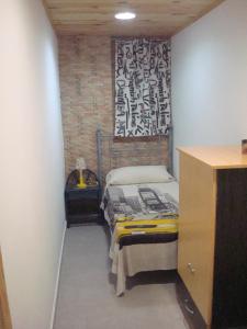 a small room with a bed in a room at Impressive in ground floor with terrace of 2 rooms and pool in Playas de Vera
