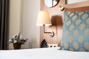 A bed or beds in a room at Grand Sirkeci Hotel