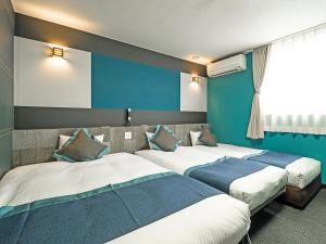 Ένα ή περισσότερα κρεβάτια σε δωμάτιο στο Hotel Areaone Tokai
