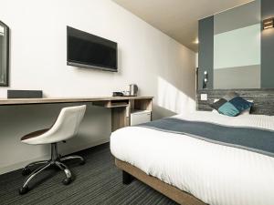 Ένα ή περισσότερα κρεβάτια σε δωμάτιο στο Hotel Areaone Tokai