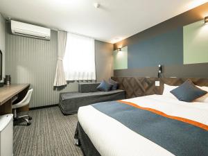 Ένα ή περισσότερα κρεβάτια σε δωμάτιο στο Hotel Areaone Tokai