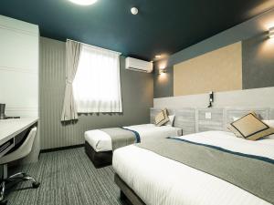 Ένα ή περισσότερα κρεβάτια σε δωμάτιο στο Hotel Areaone Tokai