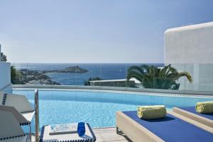 a swimming pool with a view of the ocean at Myconian Ambassador Relais & Chateaux in Platis Gialos