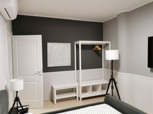 A bed or beds in a room at La Maison Latina Guest House