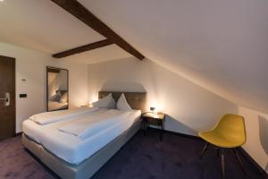 Ένα ή περισσότερα κρεβάτια σε δωμάτιο στο Hotel Mandelhof ***S