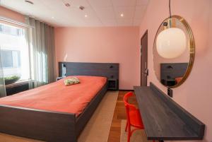 Postel nebo postele na pokoji v ubytování Staykvick Boutique Hostel