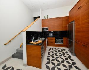 Kuchyň nebo kuchyňský kout v ubytování Staykvick Boutique Hostel