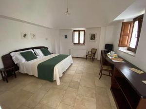 Postel nebo postele na pokoji v ubytování Il Palmento Hotel Relais