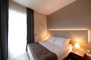 Postel nebo postele na pokoji v ubytování Hotel Majdan