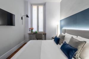 Postel nebo postele na pokoji v ubytování M20 Boutique Hotel