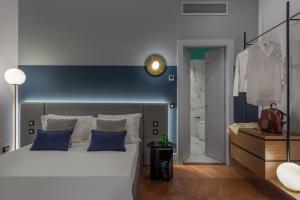 Postel nebo postele na pokoji v ubytování M20 Boutique Hotel