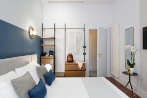 Postel nebo postele na pokoji v ubytování M20 Boutique Hotel