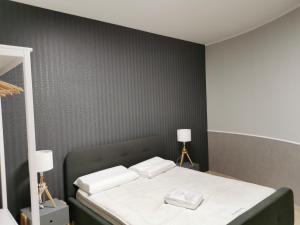 A bed or beds in a room at La Maison Latina Guest House