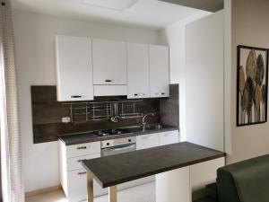 A kitchen or kitchenette at La Maison Latina Guest House