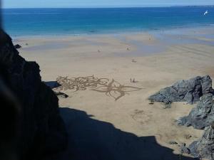 a heart drawn in the sand on a beach at Harrington Guest House in Newquay
