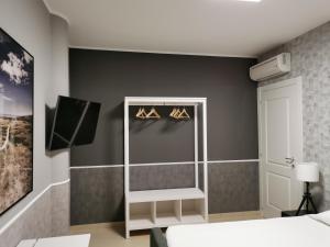 A bed or beds in a room at La Maison Latina Guest House