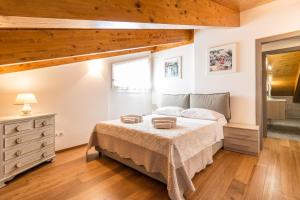 Postel nebo postele na pokoji v ubytování Apartment Belvedere 5 - Tremezzina