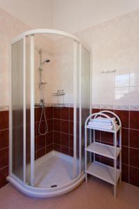 a shower with a glass enclosure in a bathroom at Casa Luisa in Poreč