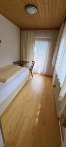 En eller flere senge i et værelse på Haus Tuxerklamm