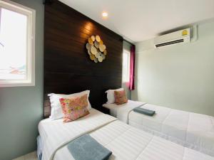 Postel nebo postele na pokoji v ubytování Phang Nga Guesthouse