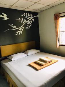 Postel nebo postele na pokoji v ubytování Phang Nga Guesthouse