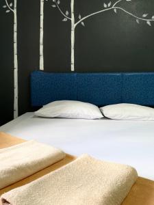 Postel nebo postele na pokoji v ubytování Phang Nga Guesthouse