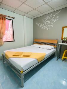Postel nebo postele na pokoji v ubytování Phang Nga Guesthouse