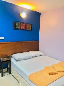 Postel nebo postele na pokoji v ubytování Phang Nga Guesthouse
