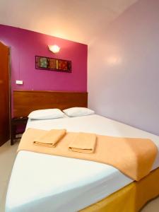 Postel nebo postele na pokoji v ubytování Phang Nga Guesthouse