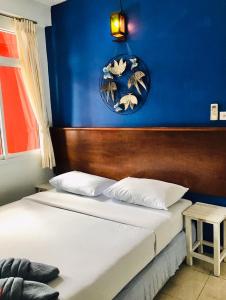 Postel nebo postele na pokoji v ubytování Phang Nga Guesthouse