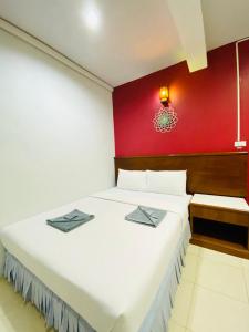 Postel nebo postele na pokoji v ubytování Phang Nga Guesthouse