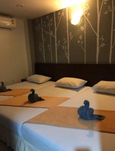 Postel nebo postele na pokoji v ubytování Phang Nga Guesthouse