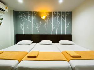 Postel nebo postele na pokoji v ubytování Phang Nga Guesthouse