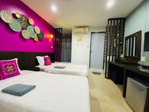 Postel nebo postele na pokoji v ubytování Phang Nga Guesthouse