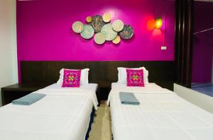 Postel nebo postele na pokoji v ubytování Phang Nga Guesthouse